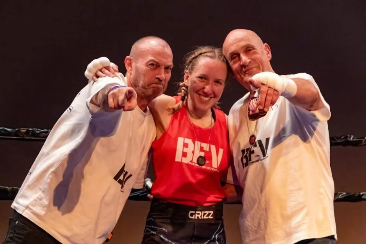 BFV participants celebrating together in a boxing ring