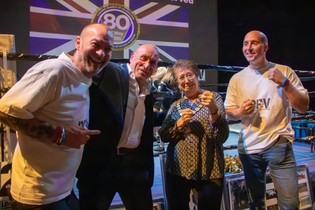 BFV event guests posing together in the boxing ring