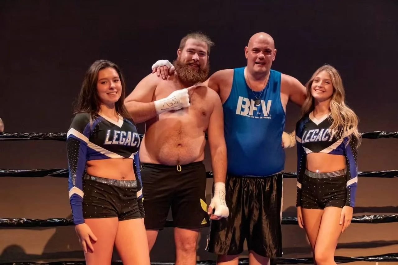 BFV boxers and supporters posing together in the ring