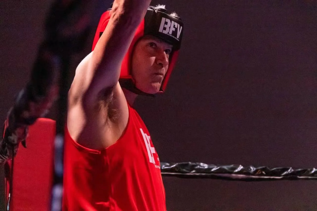 A BFV boxer raising an arm in the ring