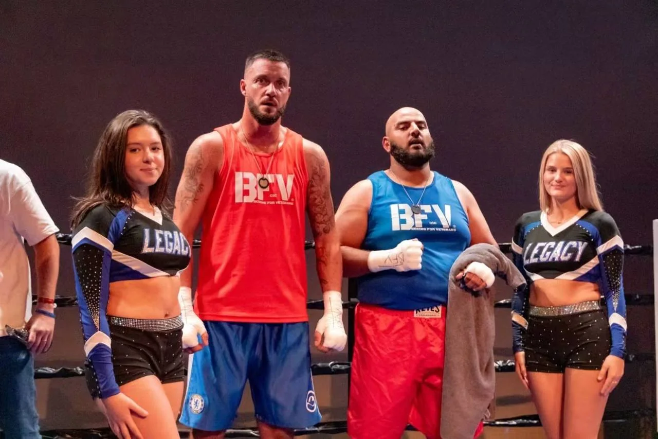 BFV boxers and supporters posing together in the ring